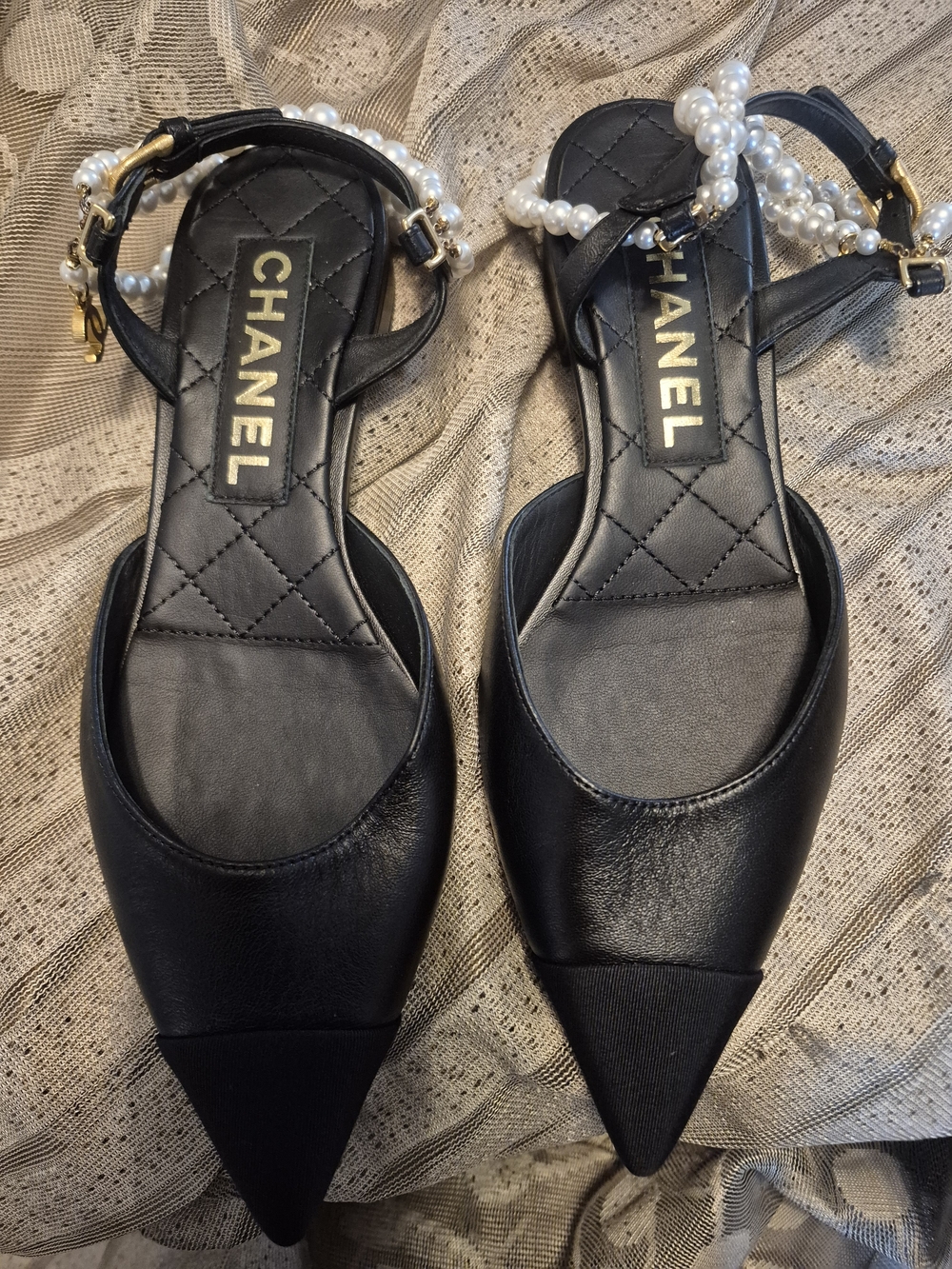 CHANEL black leather pointed-toe flats with pearls